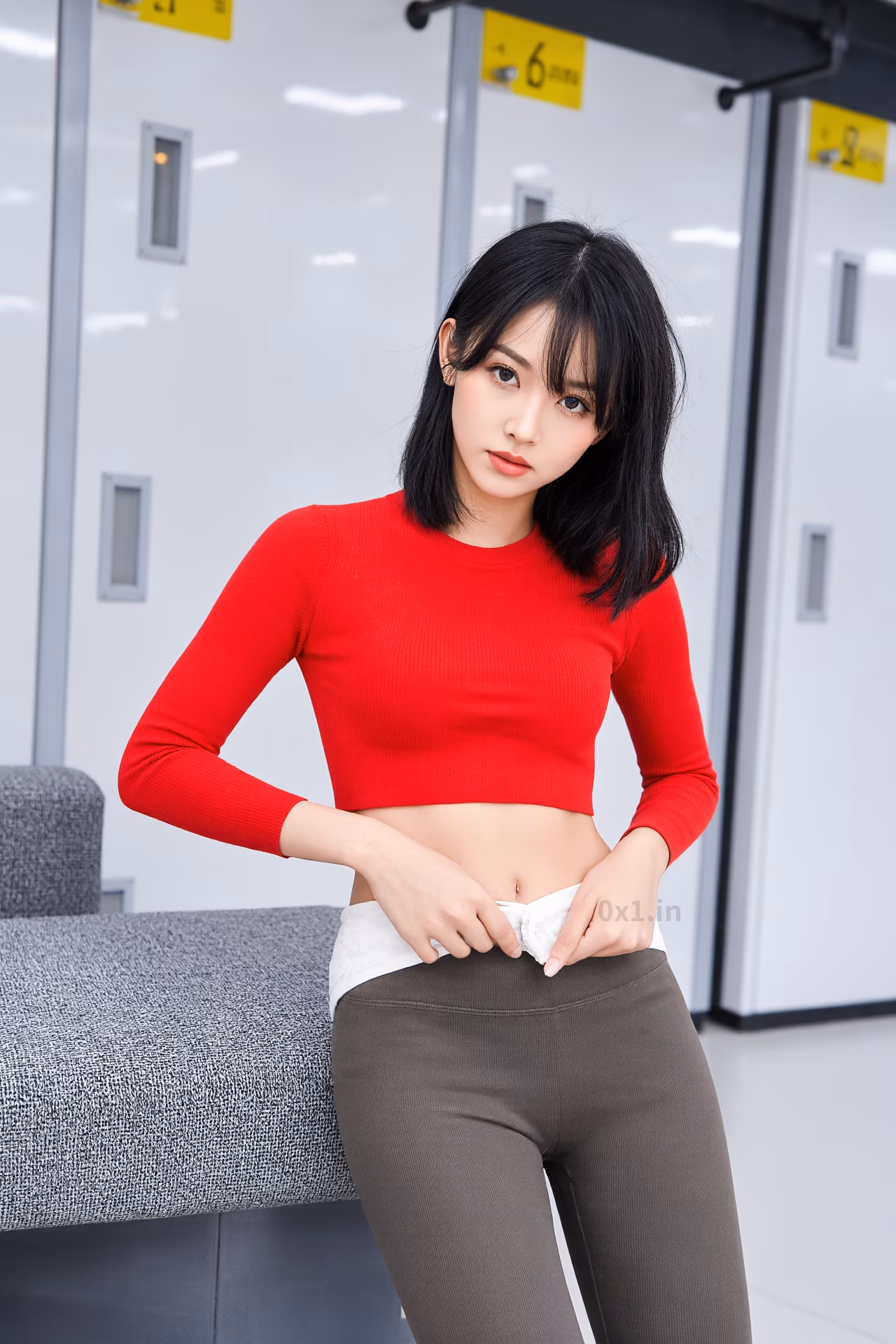 Close-up portrait of a 26-year-old slim Japanese woman with brown eyes and pink lips, smiling in stylish winter attire.