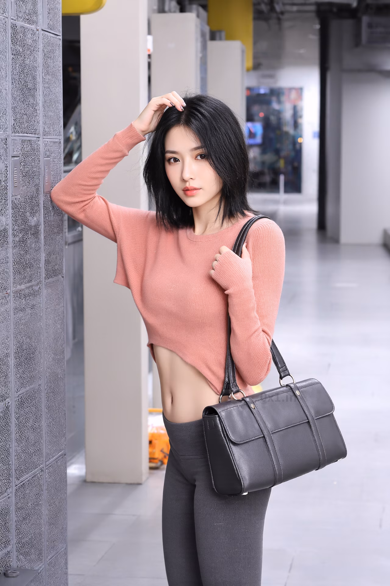 Close-up portrait of a 26-year-old slim Japanese woman with brown eyes and pink lips, smiling in stylish winter attire.